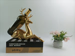 Eleganter goldener Flaschenhalter in Hirschform