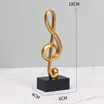 Goldene Musiknoten im 3er-Set auf schwarzem Sockel