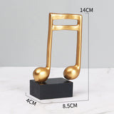 Goldene Musiknoten im 3er-Set auf schwarzem Sockel