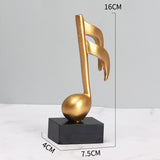 Goldene Musiknoten im 3er-Set auf schwarzem Sockel