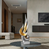 Flammenskulptur in silber mit goldenen Akzenten