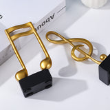 Goldene Musiknoten im 3er-Set auf schwarzem Sockel